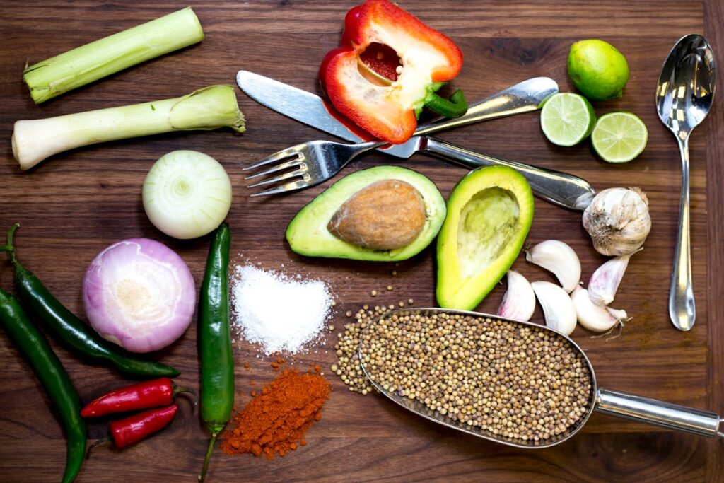 sliced avocado and tomato on chopping board