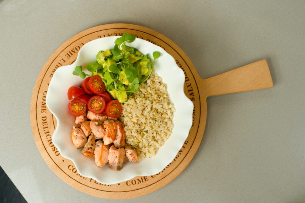 a white plate topped with meat and vegetables