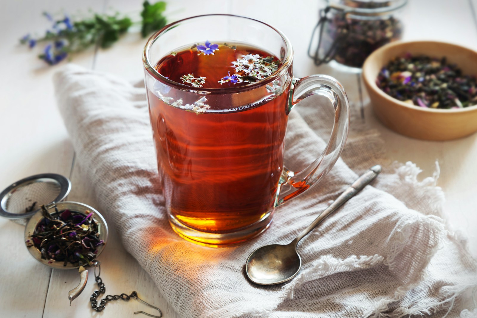 A cup of tea with a spoon next to it